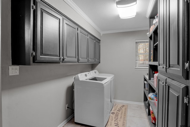 clothes washing area with cabinets, a textured ceiling, washer and clothes dryer, light tile patterned floors, and ornamental molding