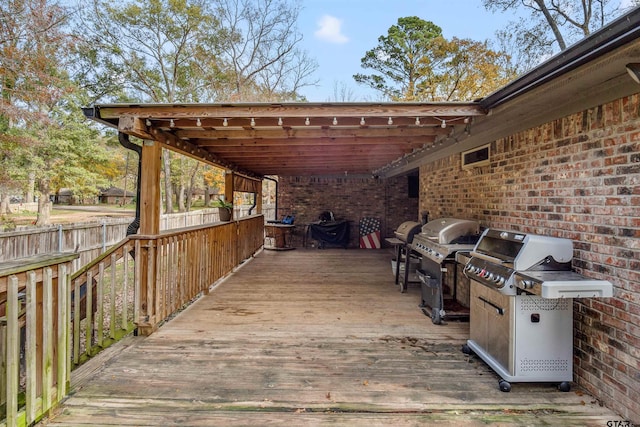 view of patio featuring a grill and a deck