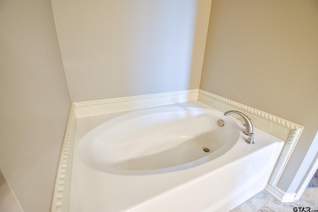 bathroom with a washtub