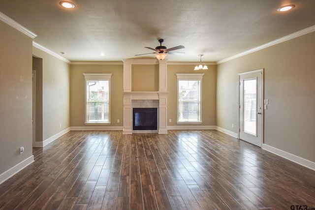 unfurnished living room featuring crown molding, ceiling fan, and a fireplace