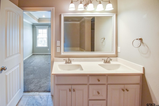 bathroom with crown molding and vanity