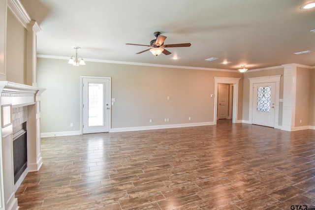 unfurnished living room with crown molding and ceiling fan with notable chandelier