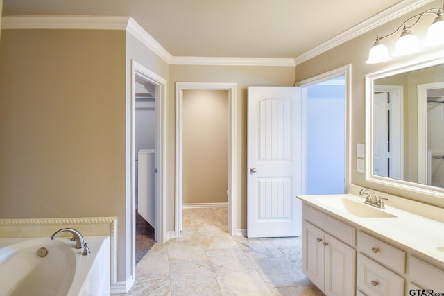 bathroom featuring ornamental molding, a bathtub, and vanity