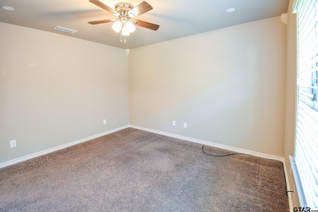 spare room with a healthy amount of sunlight and carpet