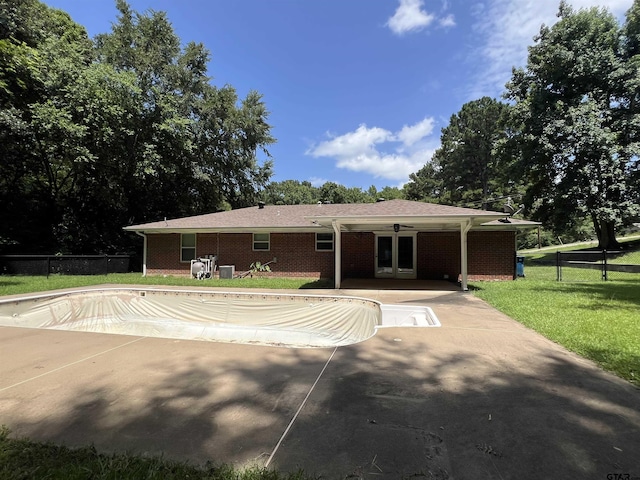 117 Harvey St, Rusk, TX 75785 - back of property featuring brick siding and french doors