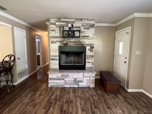 117 Harvey St, Rusk, TX 75785 - living area featuring crown molding, wood finished floors, and a stone fireplace