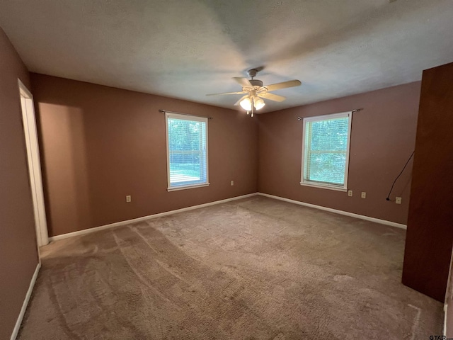117 Harvey St, Rusk, TX 75785 - empty room with a ceiling fan and carpet
