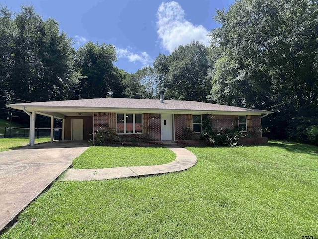 117 Harvey St, Rusk, TX 75785 - single story home with driveway, an attached carport, a front lawn, and brick siding