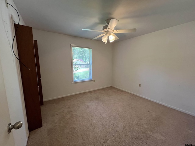 117 Harvey St, Rusk, TX 75785 - unfurnished bedroom with light carpet and ceiling fan