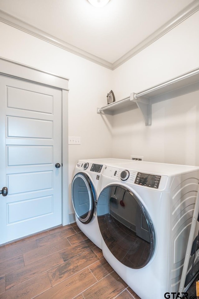 15348 C R 169, Tyler, TX 75703 - washroom with washing machine and clothes dryer, wood finished floors, and ornamental molding
