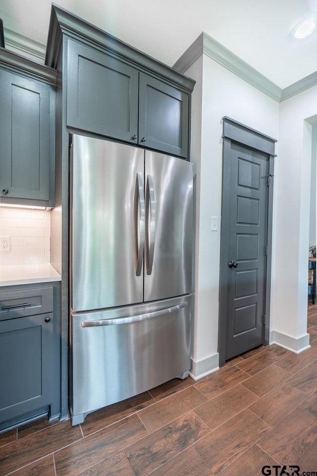 15348 C R 169, Tyler, TX 75703 - kitchen featuring freestanding refrigerator, crown molding, dark wood finished floors, light countertops, and decorative backsplash