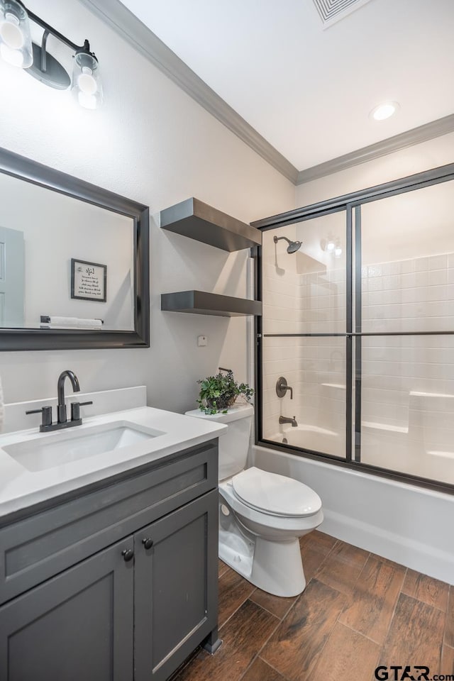 15348 C R 169, Tyler, TX 75703 - full bath featuring vanity, ornamental molding, bath / shower combo with glass door, wood finished floors, and recessed lighting