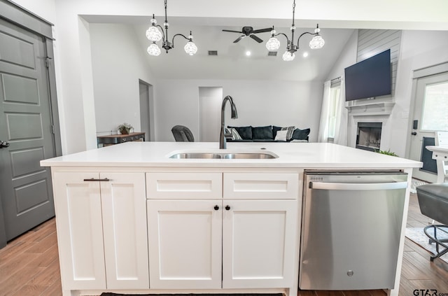 15348 C R 169, Tyler, TX 75703 - kitchen with vaulted ceiling, open floor plan, dishwasher, a fireplace, and a chandelier