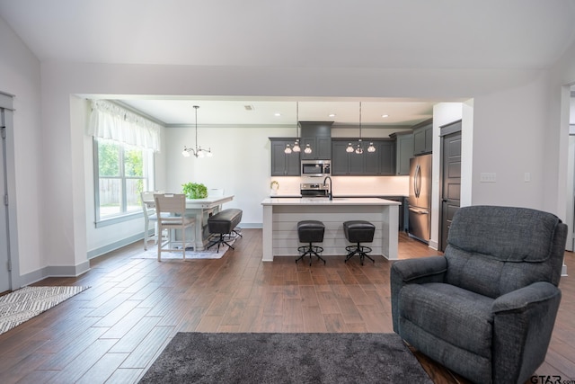 15348 C R 169, Tyler, TX 75703 - living area featuring a chandelier and dark wood finished floors