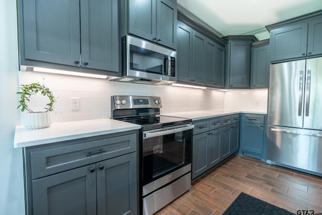 15348 C R 169, Tyler, TX 75703 - kitchen with appliances with stainless steel finishes, dark wood finished floors, light countertops, and backsplash