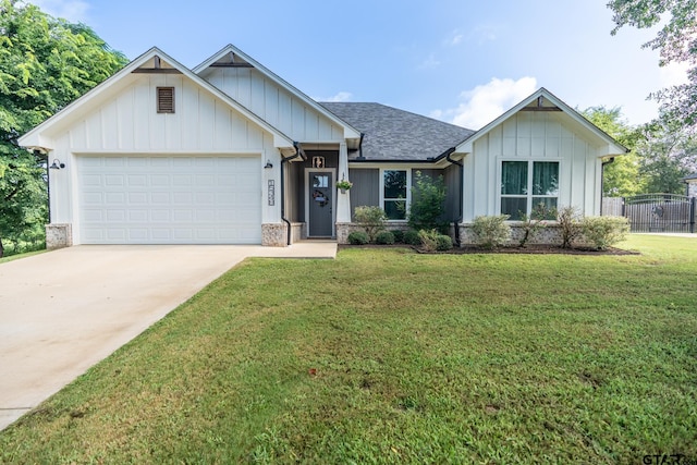 15348 C R 169, Tyler, TX 75703 - view of front of property with board and batten siding, concrete driveway, a garage, and a shingled roof