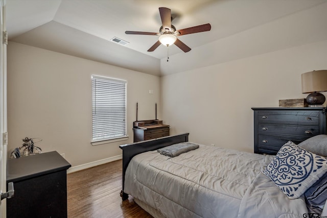 bedroom featuring dark wood-type flooring, ceiling fan, and lofted ceiling