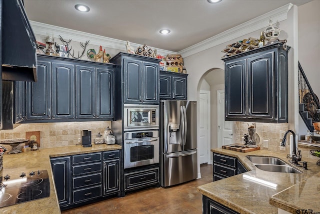 kitchen featuring decorative backsplash, appliances with stainless steel finishes, sink, and ornamental molding