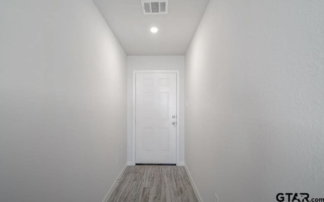 208 Parker Oaks Dr, Chandler, TX 75758 - hallway featuring wood finished floors, baseboards, and recessed lighting