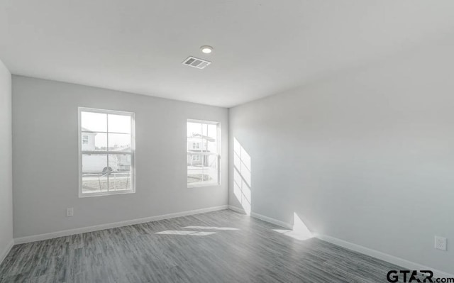 208 Parker Oaks Dr, Chandler, TX 75758 - unfurnished room with wood finished floors and baseboards