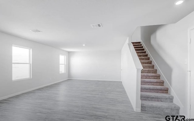 208 Parker Oaks Dr, Chandler, TX 75758 - below grade area featuring wood finished floors, recessed lighting, stairway, and baseboards