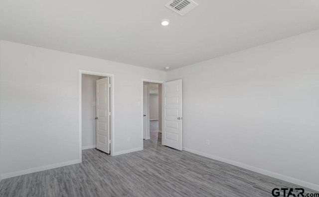 208 Parker Oaks Dr, Chandler, TX 75758 - unfurnished bedroom featuring wood finished floors, baseboards, and recessed lighting