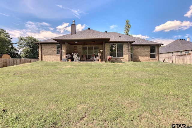 113 Stuart St, Arp, TX 75750 - rear view of house featuring a chimney, brick siding, and a shingled roof