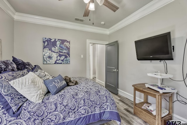 113 Stuart St, Arp, TX 75750 - bedroom featuring crown molding, wood finished floors, and a ceiling fan