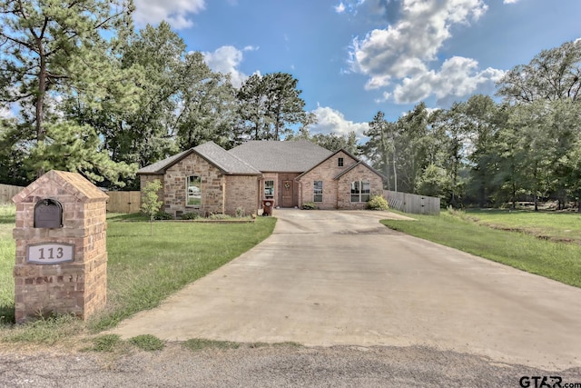 113 Stuart St, Arp, TX 75750 - french country inspired facade with brick siding, a shingled roof, and driveway