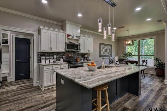 113 Stuart St, Arp, TX 75750 - kitchen with stainless steel appliances, dark wood-style flooring, tasteful backsplash, ornamental molding, and white cabinetry