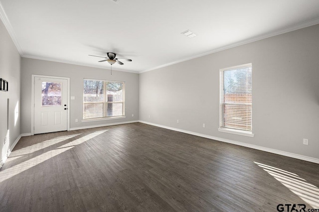 unfurnished living room featuring dark hardwood / wood-style flooring, plenty of natural light, crown molding, and ceiling fan