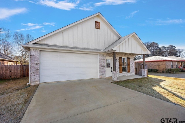 view of front of property with a front lawn and a garage