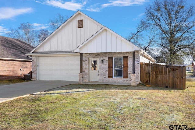 view of front of house featuring a garage and a front lawn