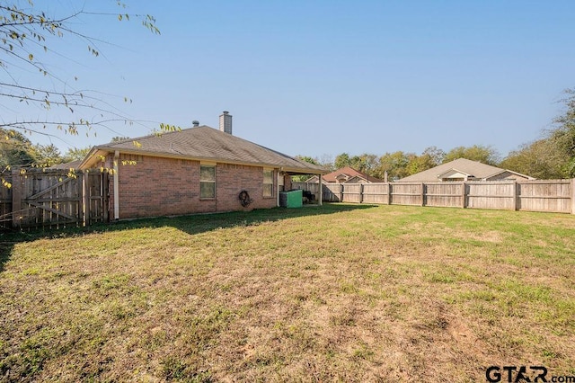 view of yard featuring central AC unit