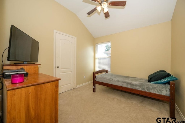 carpeted bedroom with ceiling fan and lofted ceiling