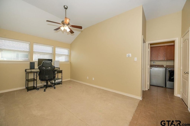 tiled office with ceiling fan, independent washer and dryer, and vaulted ceiling