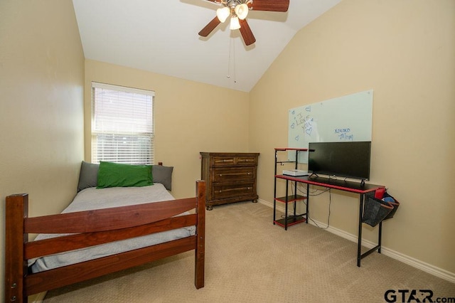 bedroom featuring ceiling fan, light carpet, and vaulted ceiling