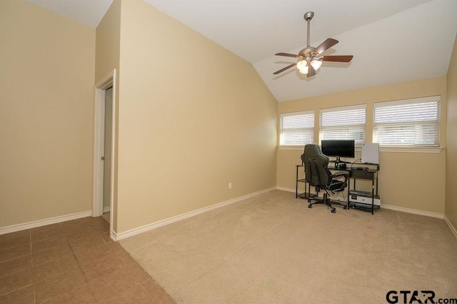 tiled office space with ceiling fan and vaulted ceiling