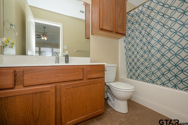 full bathroom featuring ceiling fan, shower / bath combo, tile patterned flooring, toilet, and vanity