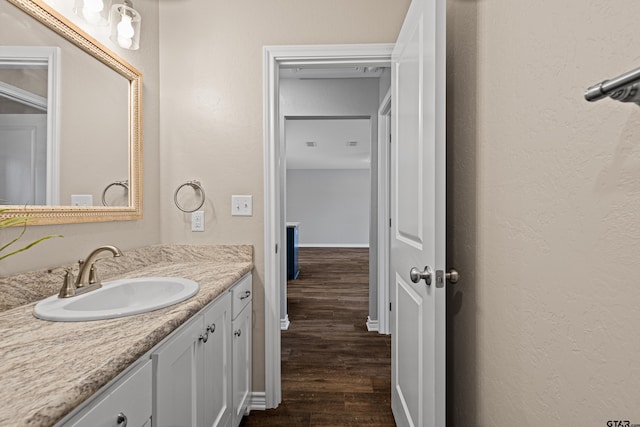 bathroom featuring wood-type flooring and vanity