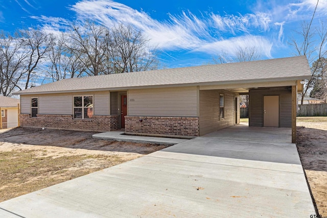 ranch-style house featuring a carport