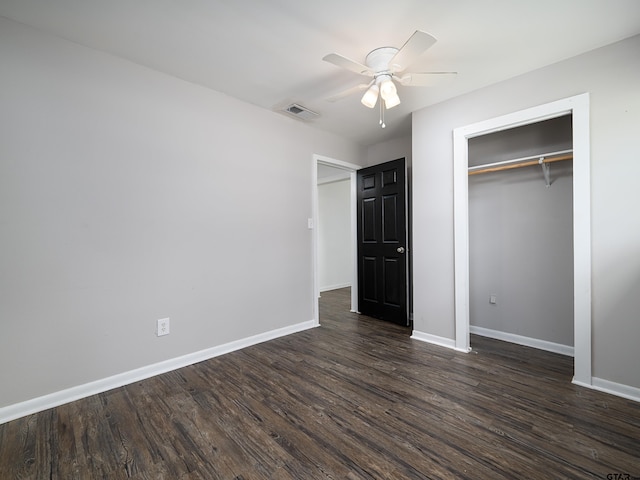 501 S Railroad St, Troup, TX 75789 - unfurnished bedroom with dark wood finished floors, a closet, and a ceiling fan