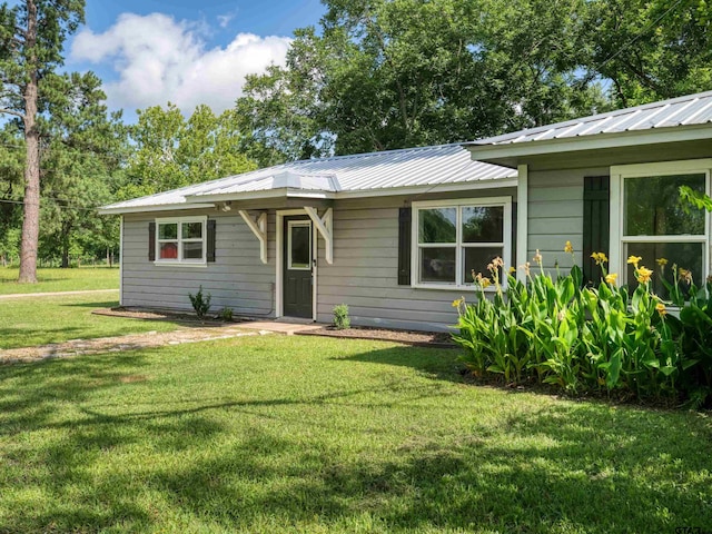 501 S Railroad St, Troup, TX 75789 - bungalow featuring a front lawn and a metal roof