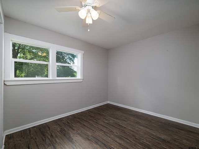 501 S Railroad St, Troup, TX 75789 - unfurnished room with healthy amount of natural light and dark wood-type flooring