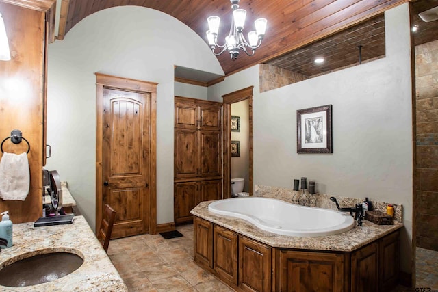 14647 County Road 2337, Tyler, TX 75707 - full bathroom featuring vanity, a chandelier, toilet, a bath, and lofted ceiling