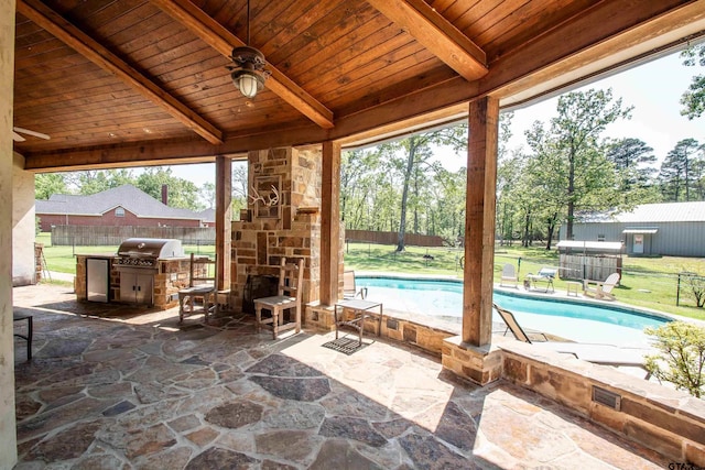 14647 County Road 2337, Tyler, TX 75707 - view of patio / terrace featuring a fenced in pool, an outdoor stone fireplace, a grill, a ceiling fan, and fence