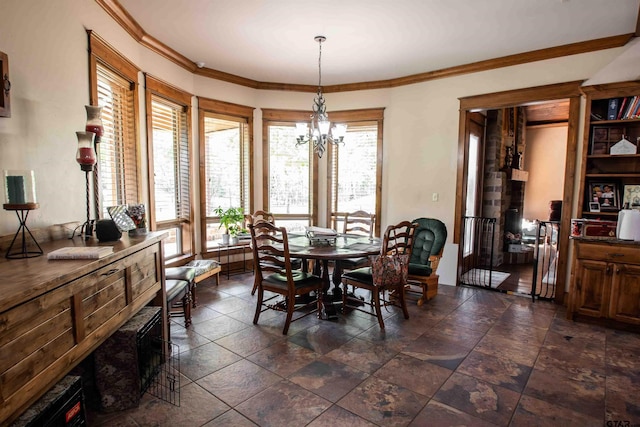 14647 County Road 2337, Tyler, TX 75707 - dining space with a wealth of natural light, a notable chandelier, and ornamental molding