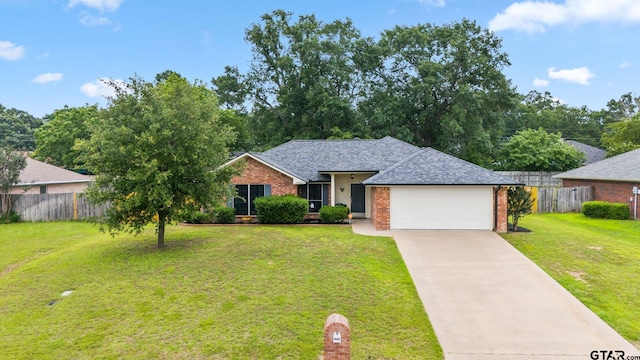 ranch-style home with a garage and a front yard