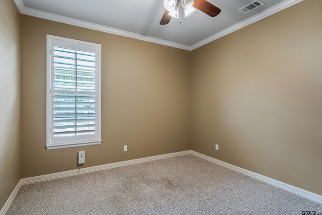 carpeted empty room featuring ceiling fan, crown molding, and baseboards