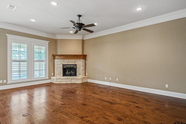 unfurnished living room with crown molding, ceiling fan, wood finished floors, a fireplace, and recessed lighting